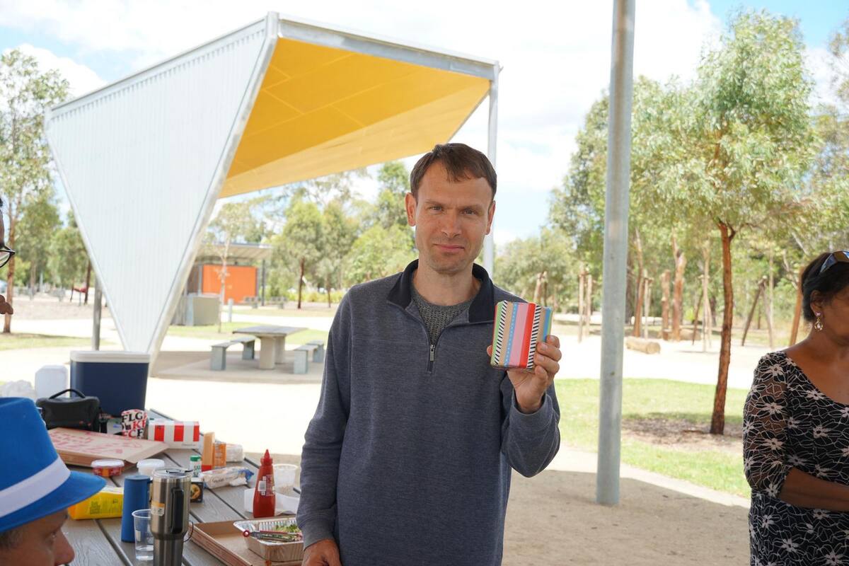 Enable Hub participant and support worker sharing a moment at a community event